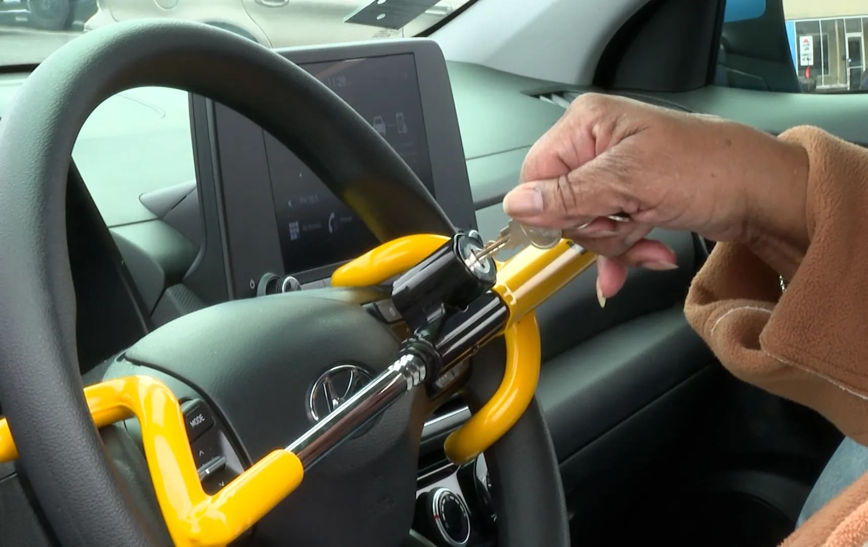 Comprehensive testing of steering wheel locks across different UK vehicle types with professional automotive security arrangement and clear product comparison layout